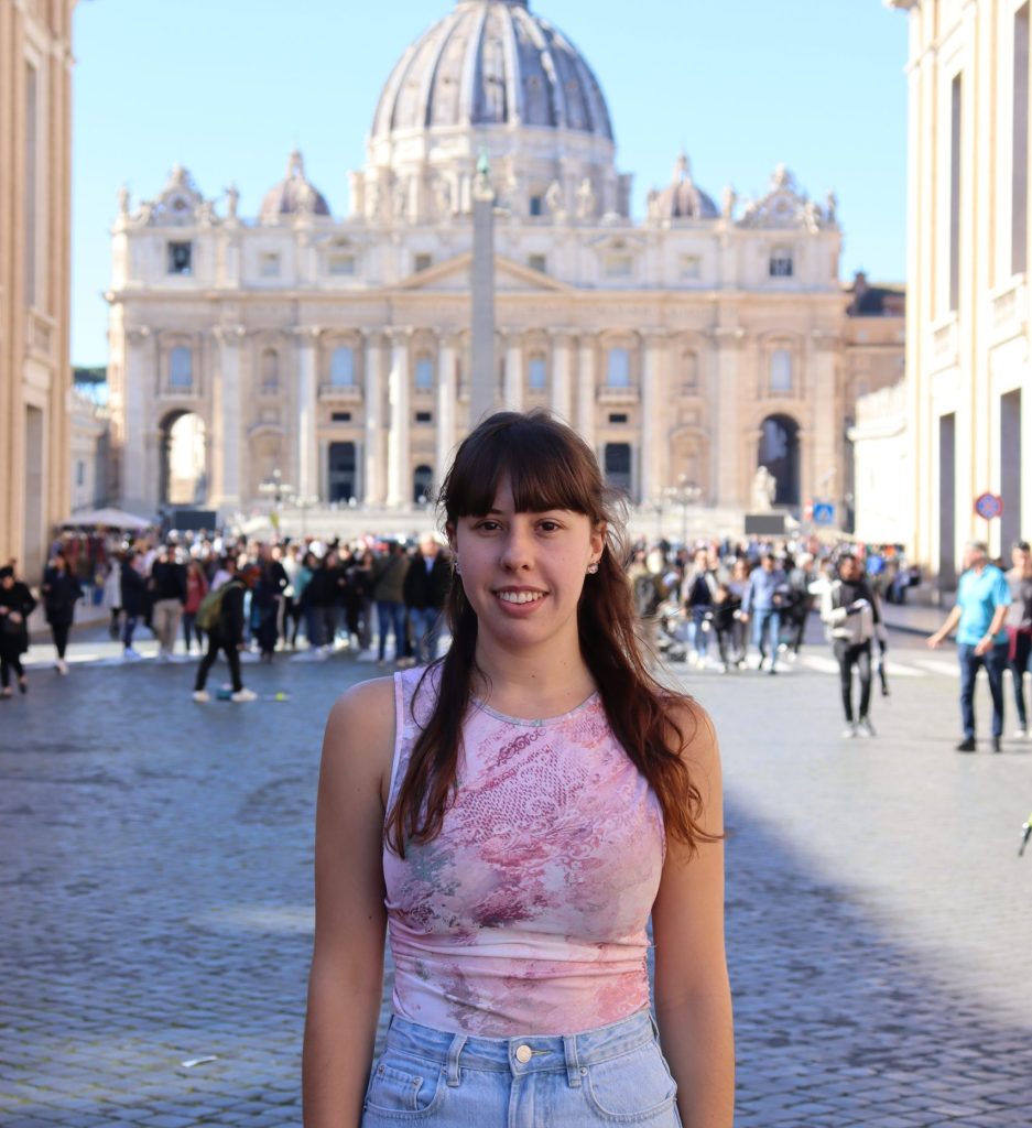 person standing in front of a building